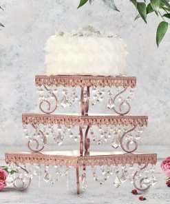 HIER_4110 Chargers & Centerpieces Set Of 3 | Rose Gold Chandelier Metal Cake Stands, 3-Tier Square Cupcake Display, Stackable Dessert Risers With Crystal Pendants