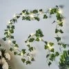 HIER_3720 Chargers & Centerpieces 7FT | Artificial Green Ivy Leaf Garland Vine With LED Battery Operated Fairy String Lights - Warm White