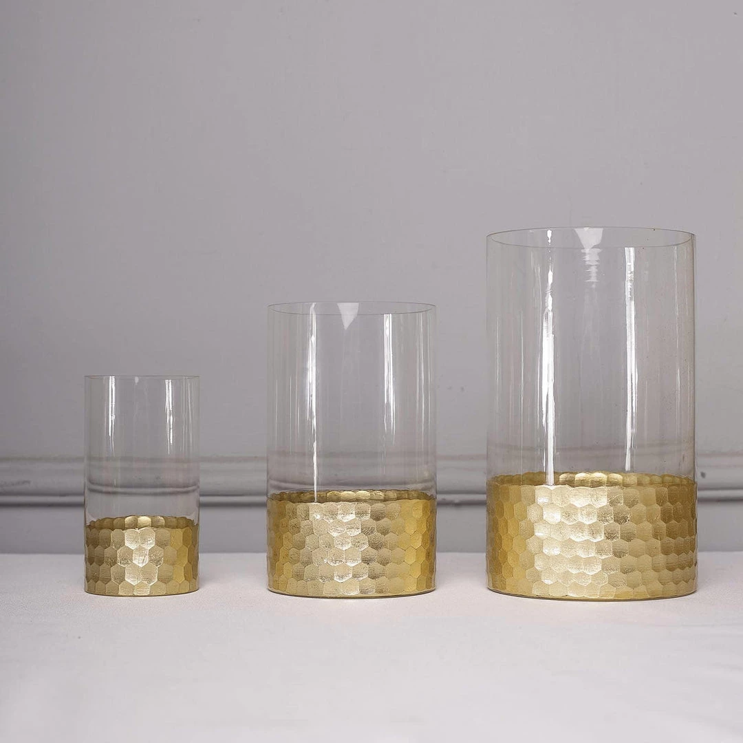 HIER_4810 Chargers & Centerpieces Set Of 3 | Glass Cylinder Vases With Gold Honeycomb Base | Glass Candle Holders | 6" | 8" | 10" 12 HIER_4810 Chargers & Centerpieces Set Of 3 | Glass Cylinder Vases With Gold Honeycomb Base | Glass Candle Holders | 6" | 8" | 10"